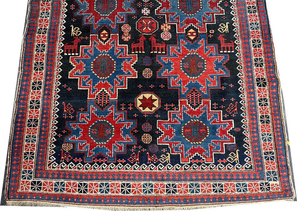 An Antique Decorative Blue Ground Caucasian Shirvan Rug