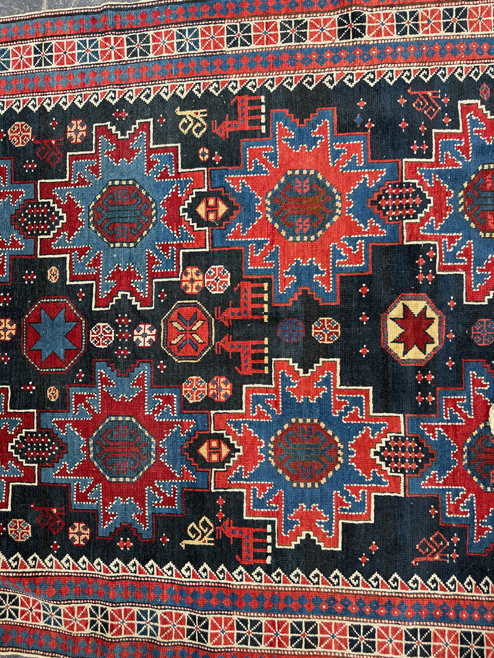 An Antique Decorative Blue Ground Caucasian Shirvan Rug