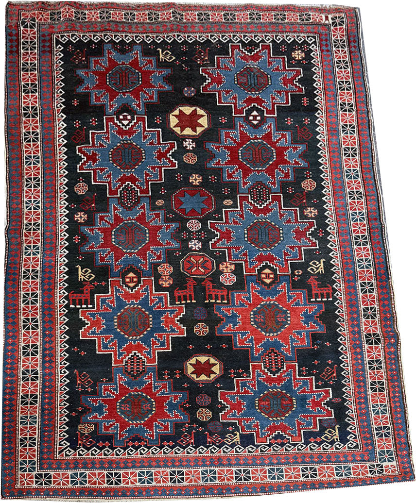 An Antique Decorative Blue Ground Caucasian Shirvan Rug